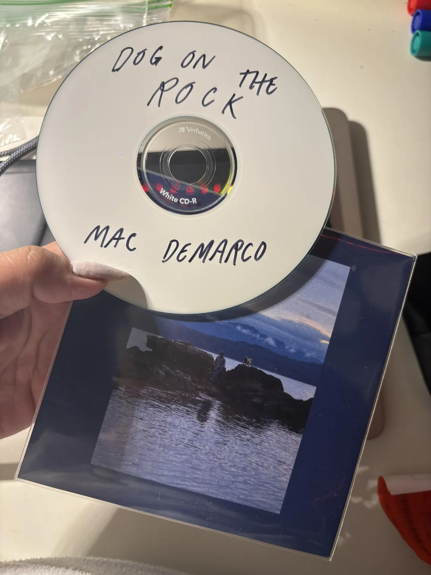 Mac gives fans a copy of an album called "Dog on the Rock" 3